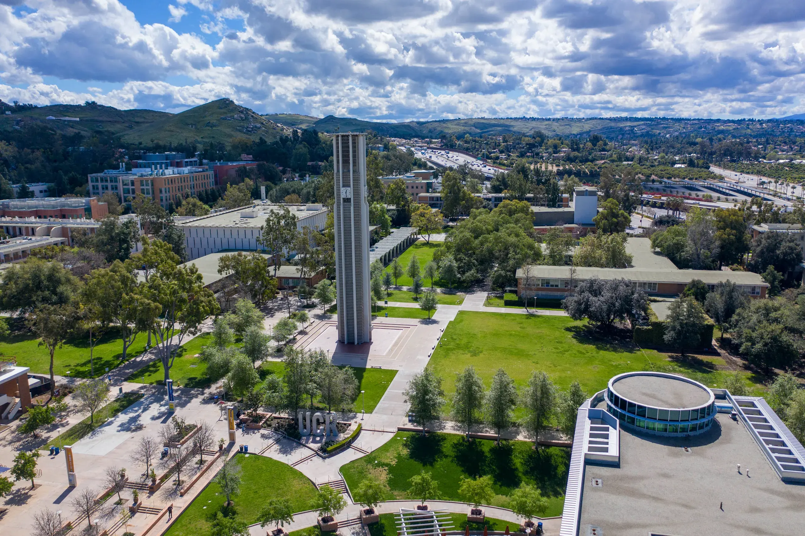 The UC Riverside campus from the air, the bell tower at its centre and the valley beyond