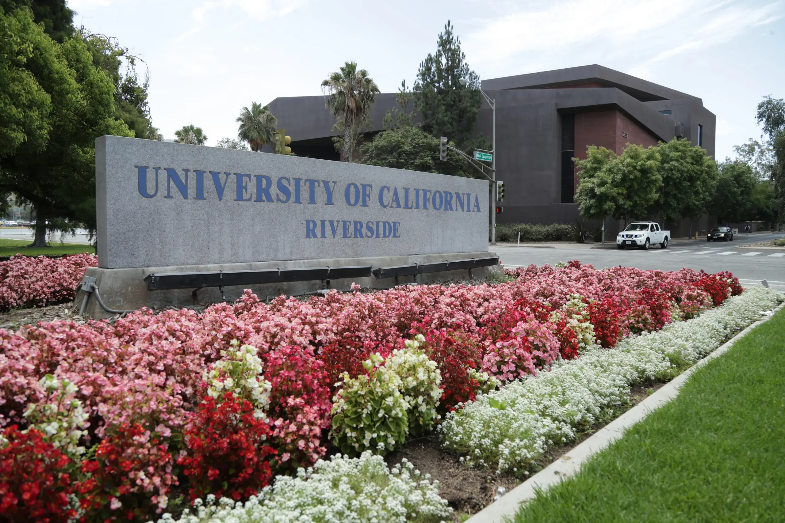 The University of California, Riverside entrance sign, flower beds in front of it