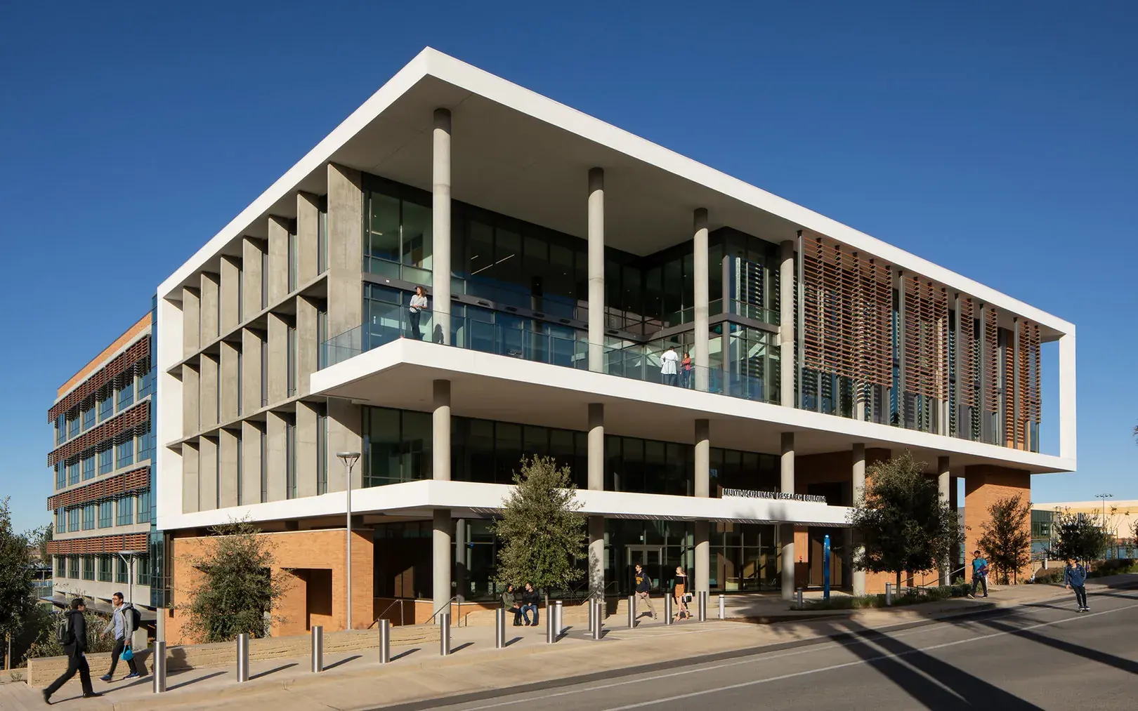 The Multidisciplinary Research Building from Aberdeen Drive, its glazed corner and timber screen facing the street